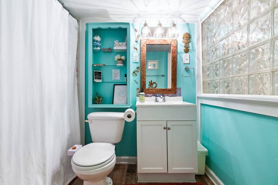 Welcome to a spacious bathroom that combines functionality and luxury, featuring both a shower and a bathtub.