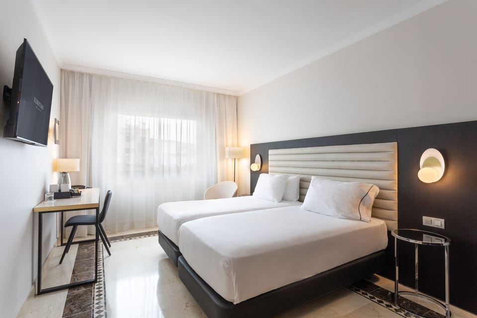 Double Room | Minibar, in-room safe, desk, iron/ironing board
