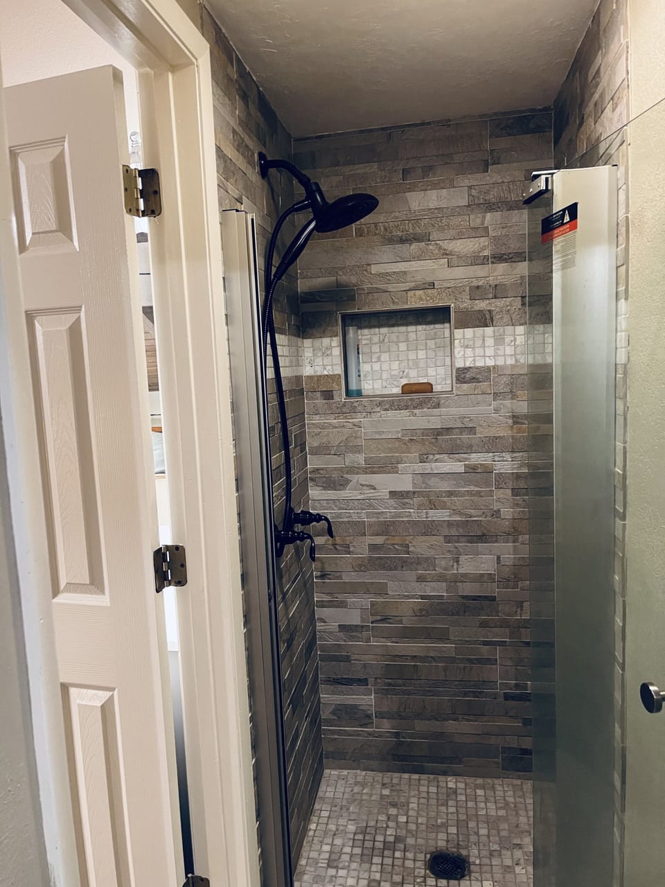 Upstairs shower with bath.