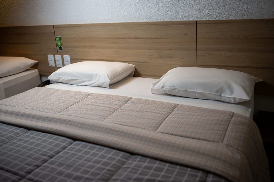 Standard Twin Room, 2 Double Beds | Minibar, in-room safe, desk, blackout drapes