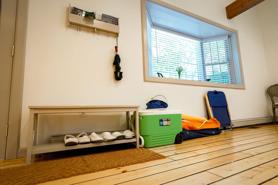 1ST FLOOR: Ice chest, clamming rake/bucket, 3 beach chairs, mat, and parasol