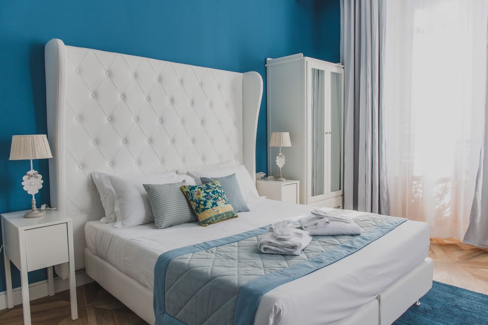 Deluxe Triple Room | Minibar, blackout drapes, free WiFi, bed sheets