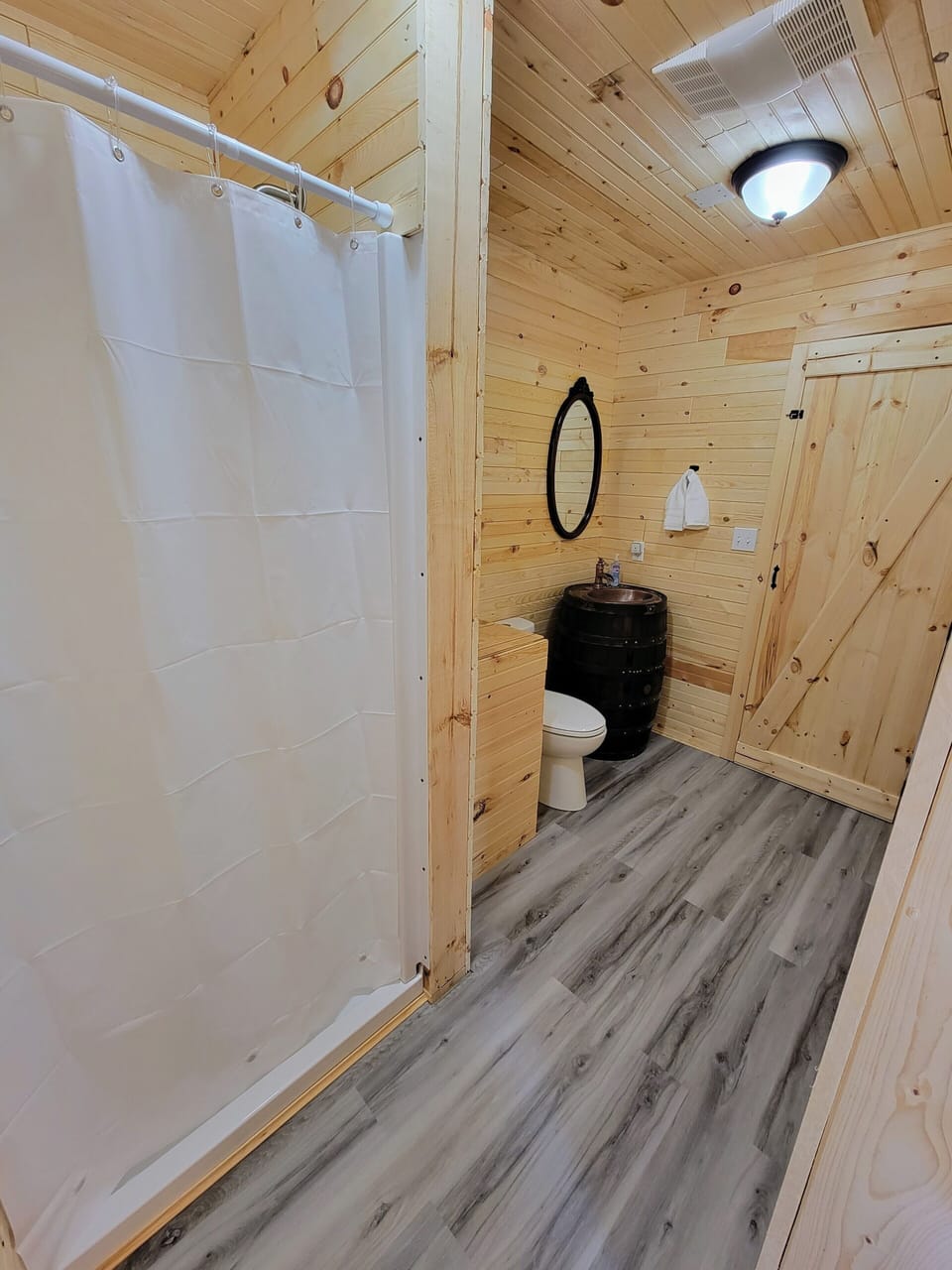 Bathroom with handcrafted bourbon barrel sink