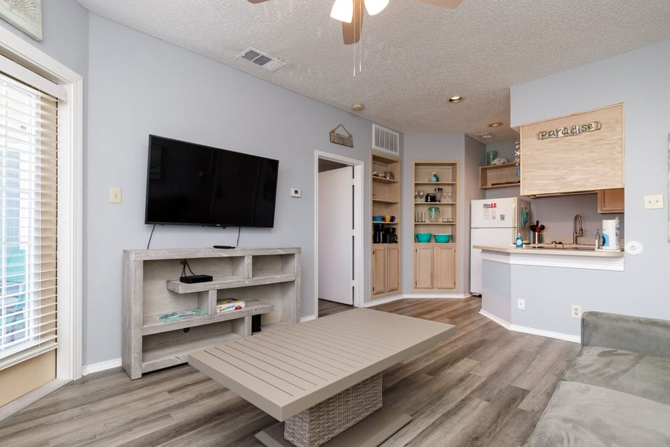 Relax in your bright open-concept living space with modern kitchen and cozy seating area perfect for unwinding.