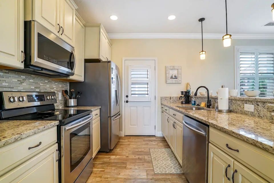 Roomy kitchen with stainless steel appliances & everything you need to cook.