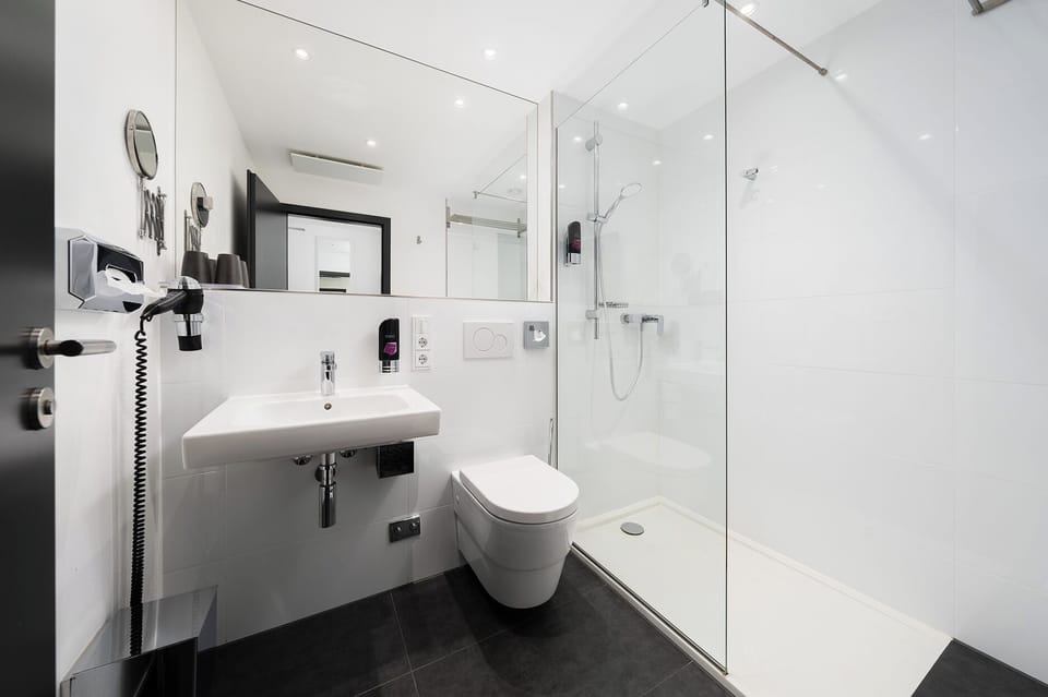 Shower, hair dryer, slippers, towels
