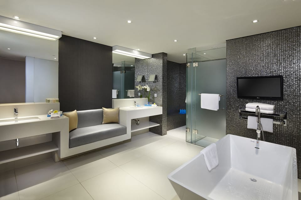 Separate tub and shower, rainfall showerhead, designer toiletries