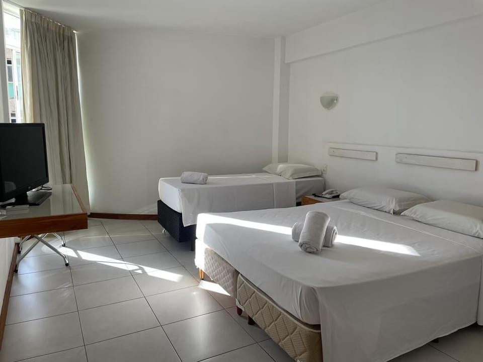 Standard Triple Room | Minibar, desk, iron/ironing board, free WiFi
