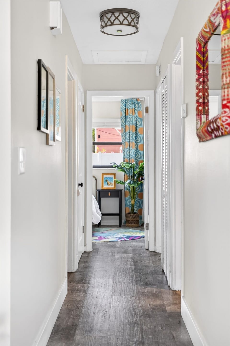 Back inside the hallway leads from the living room to all 3 bedrooms.