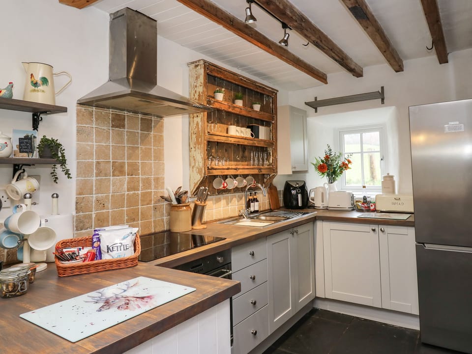 Fridge, electric kettle, cookware/dishes/utensils