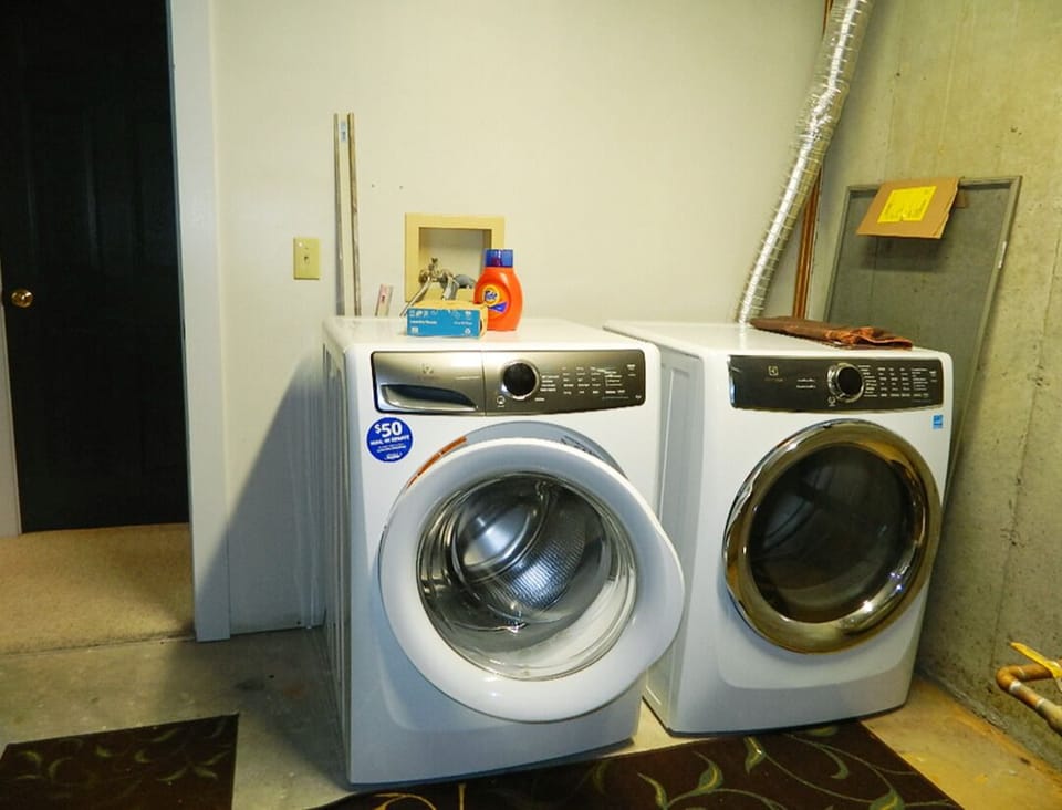 Washer dryer in utility room, lower level