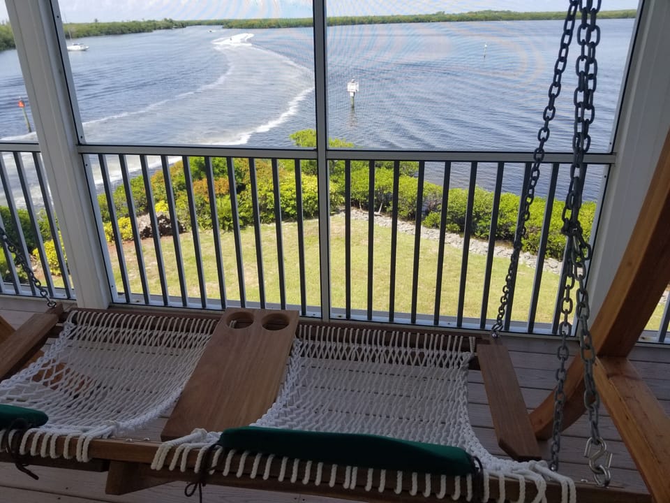 upstairs covered deck, walkout from each bedroom.  sea breeze!