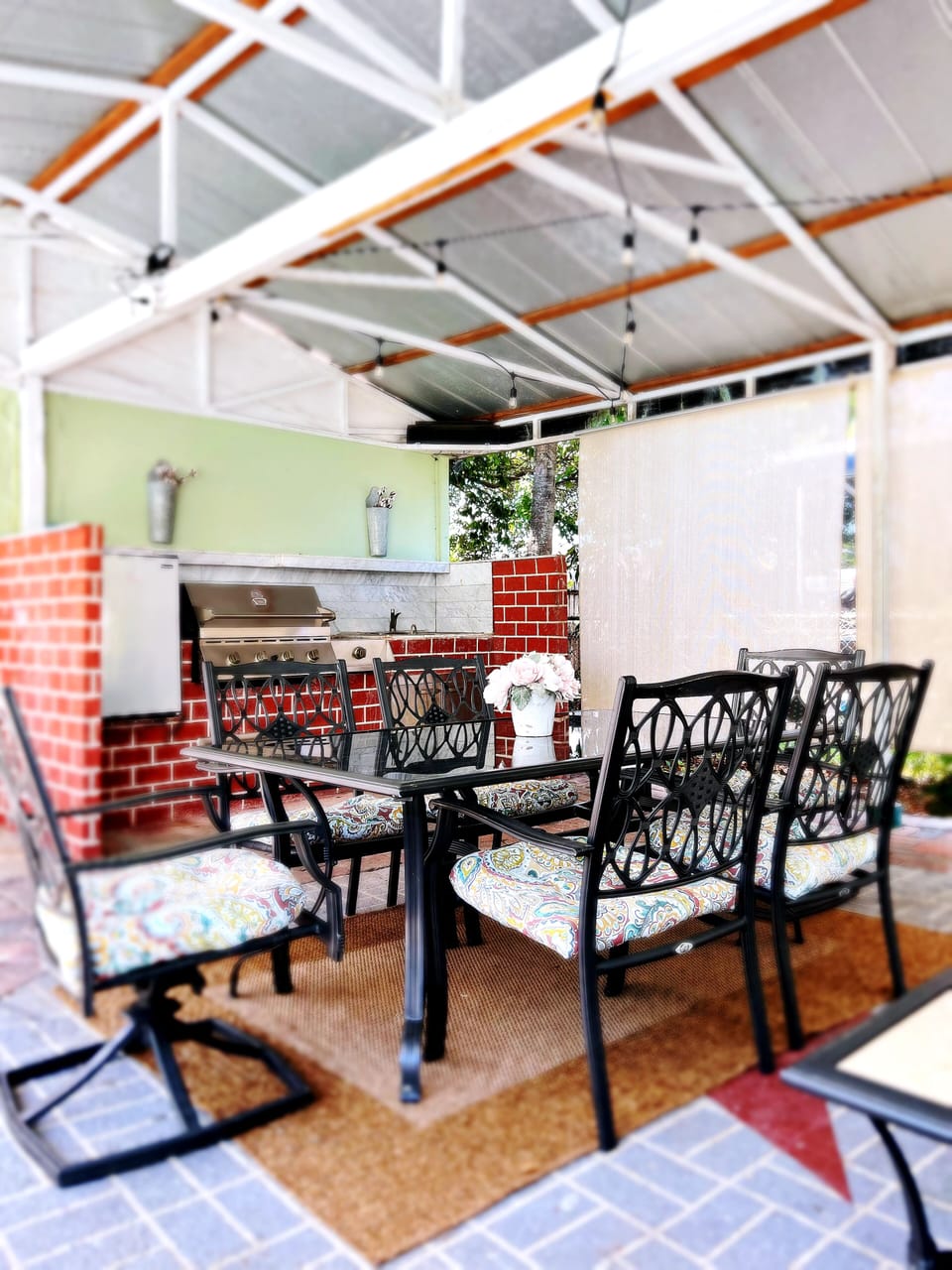 Outdoor kitchen/ Grill with mini fridge for cold drinks. 