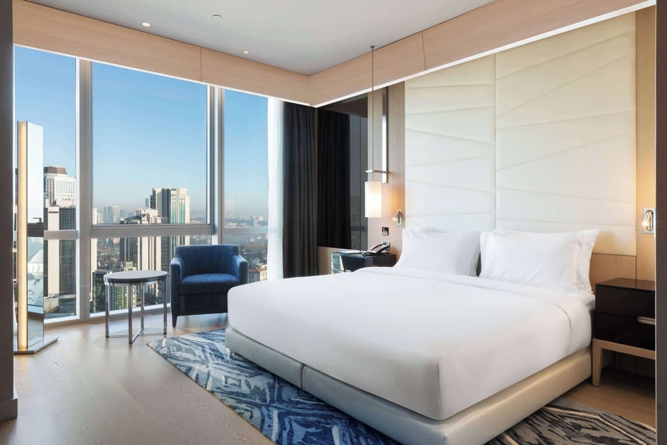 Deluxe Room, 1 King Bed, Accessible, City View | Premium bedding, minibar, in-room safe, desk
