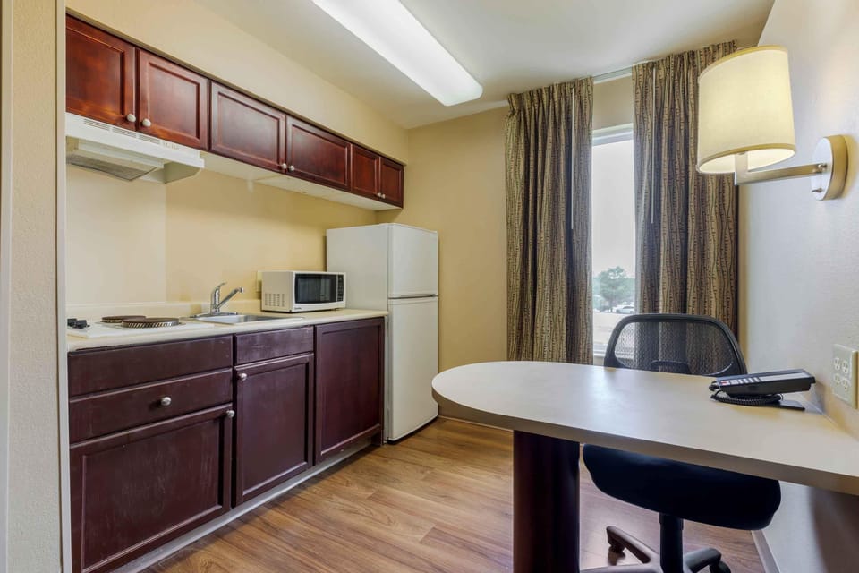 Deluxe Studio, 1 Queen Bed with Sofa bed, Non Smoking | Private kitchen | Full-size fridge, microwave, stovetop, coffee/tea maker