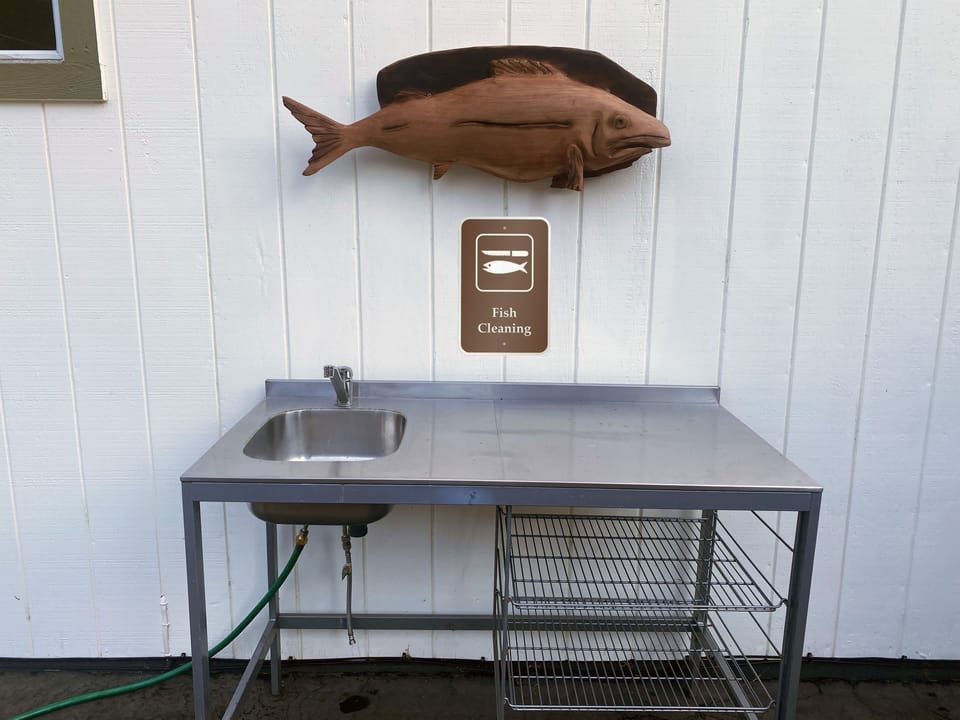The house is equipped with an outdoor fish cleaning station for guest use.