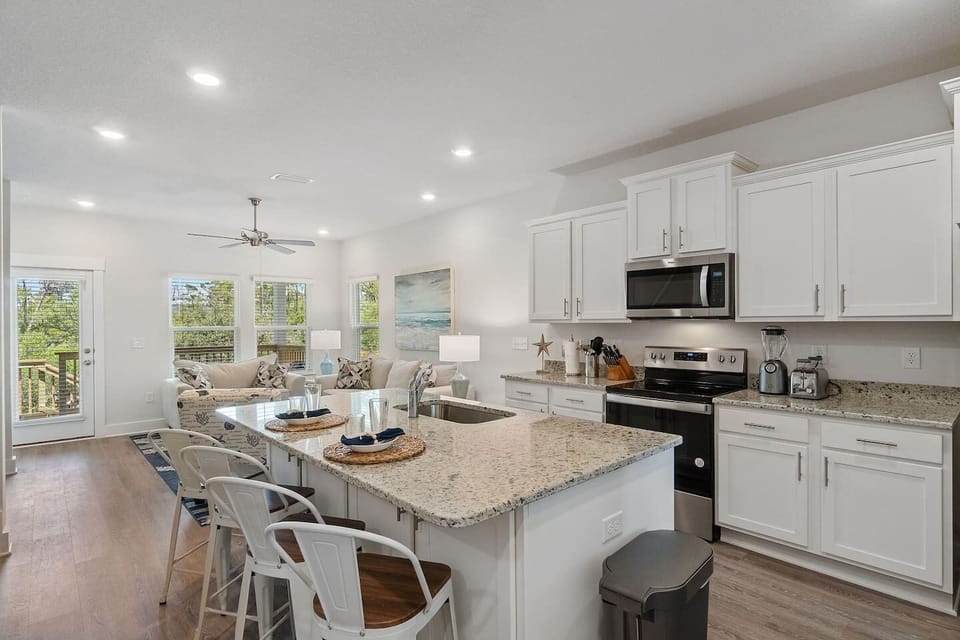 First floor features family room, fully-stocked kitchen with air fryer...