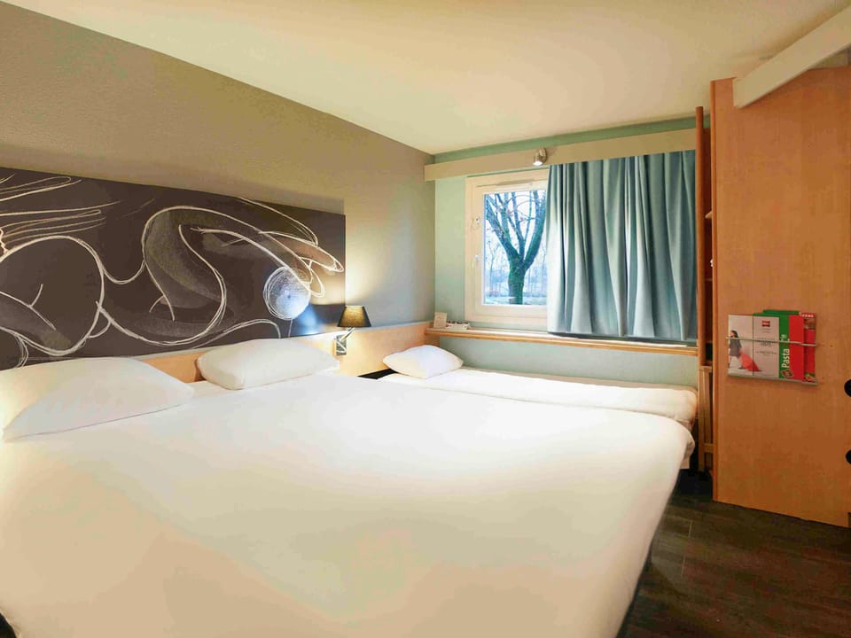 Premium bedding, desk, laptop workspace, soundproofing