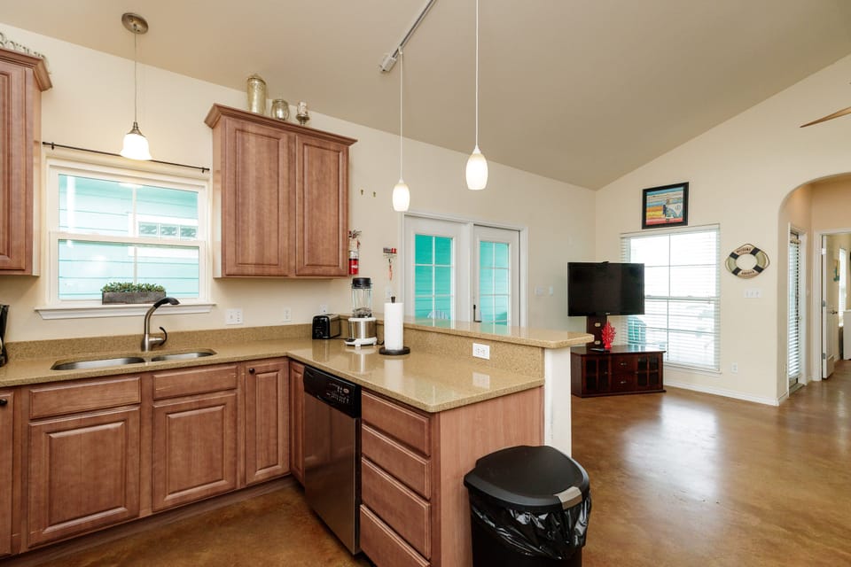 Your open kitchen flows seamlessly into the living area, creating perfect space for cooking and relaxing together.