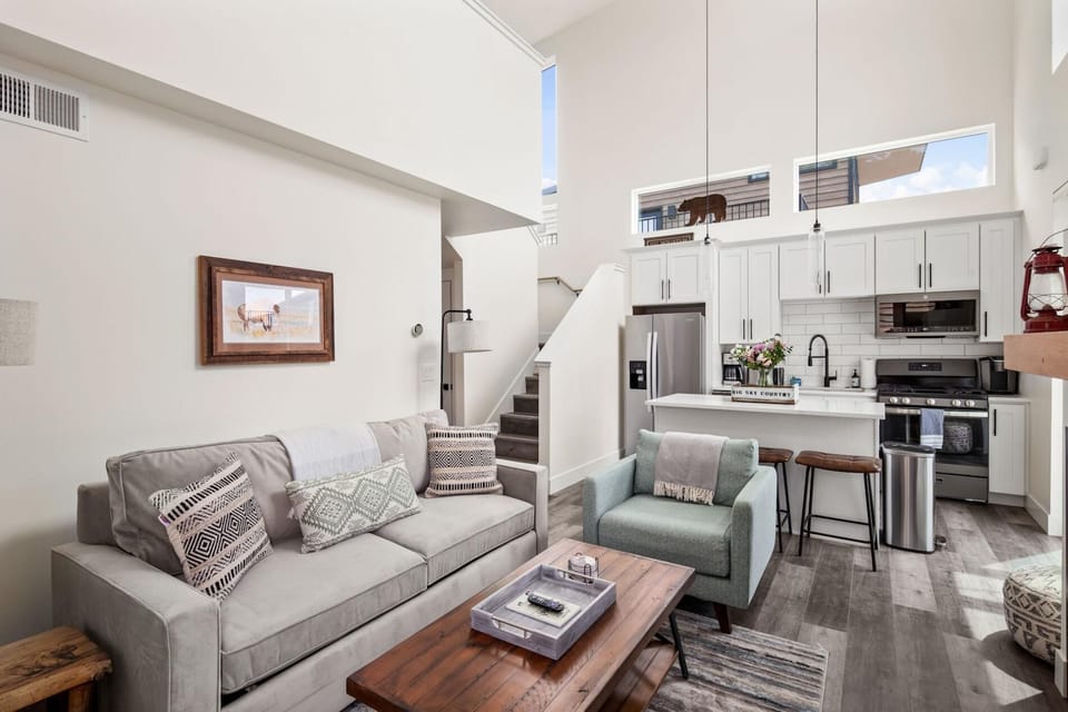 The living room features a luxury memory foam queen size pullout, large HDTV with streaming capabilities, gas fireplace, and vaulted ceilings.