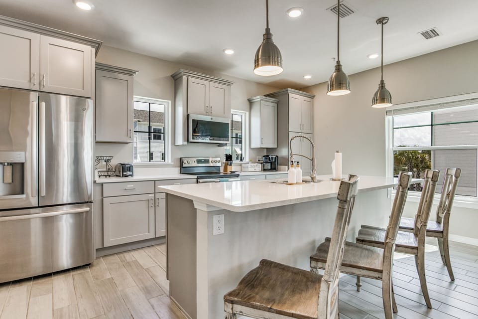 Your modern kitchen provides an inviting space for quick coffee or a full meal