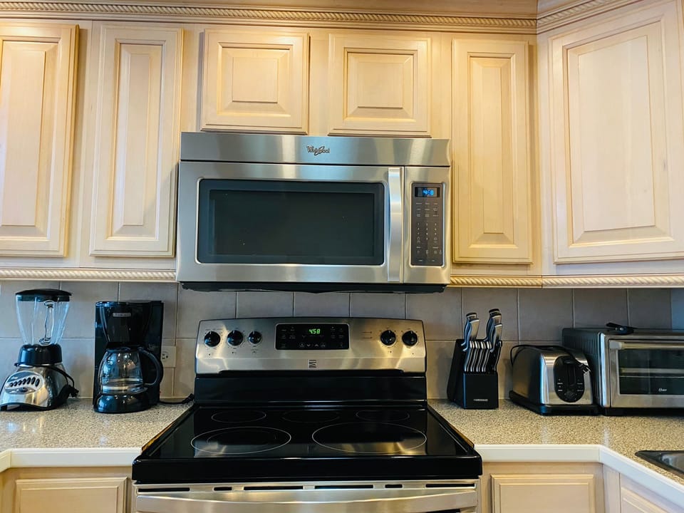 At your service there is a stove, oven, microwave, toaster, coffee maker