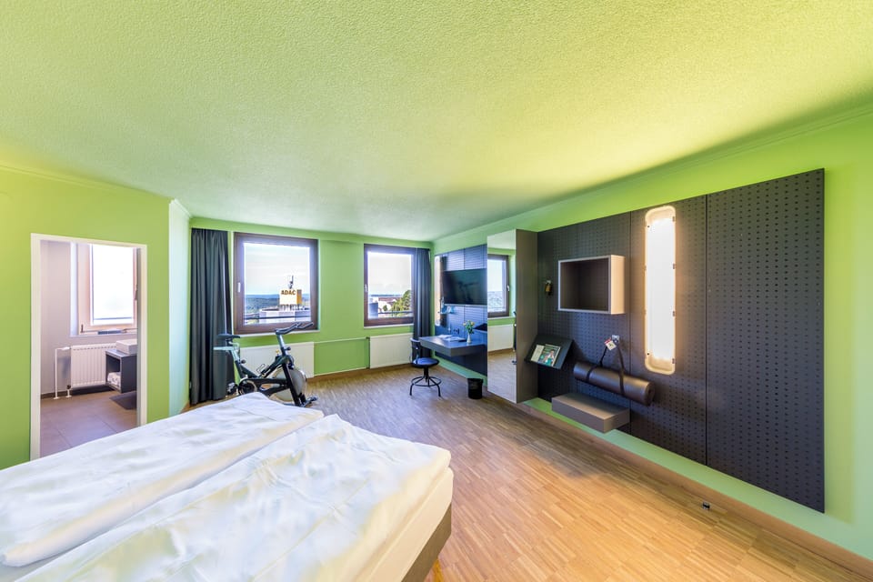Premium bedding, desk, laptop workspace, blackout drapes