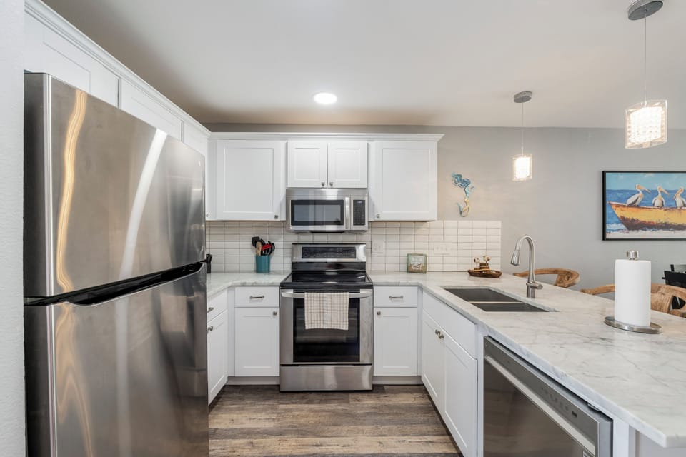 Your fully equipped kitchen features stainless steel appliances and granite counters, perfect for preparing meals during your stay.