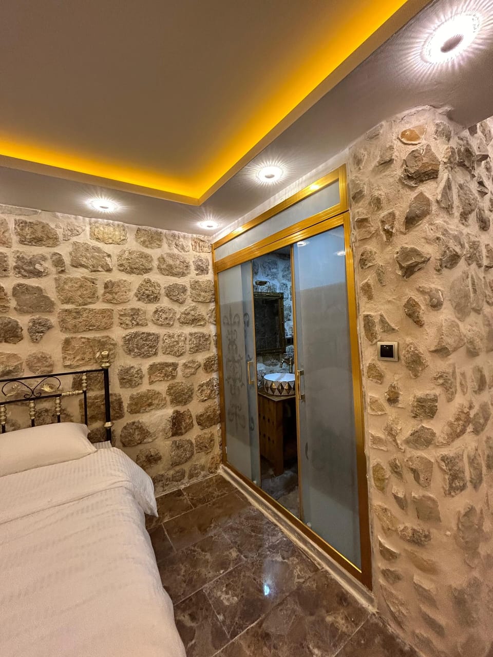Shower, rainfall showerhead, slippers, towels