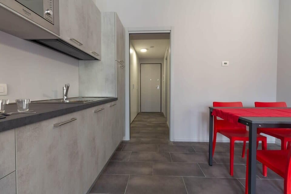 Kitchen apartment Papavero - Affitti Brevi Italia near the historic center. Ideal for couples or business stays. Kitchenette equipped and furnished with every comfort. wifi free laundry including parking nearby induction plan
