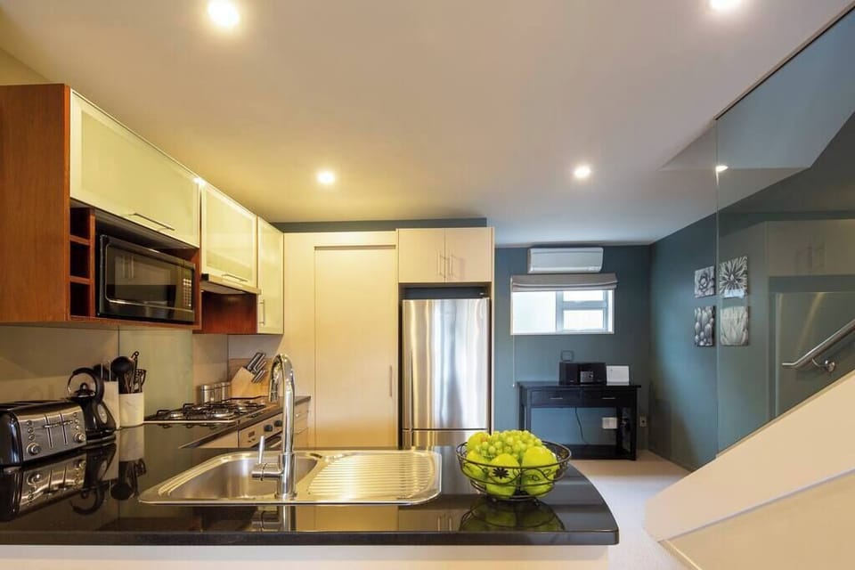Fully Equipped Gourmet Kitchen
Cook in style in this modern kitchen, equipped with top-of-the-line appliances and ample counter space, making meal prep a breeze.