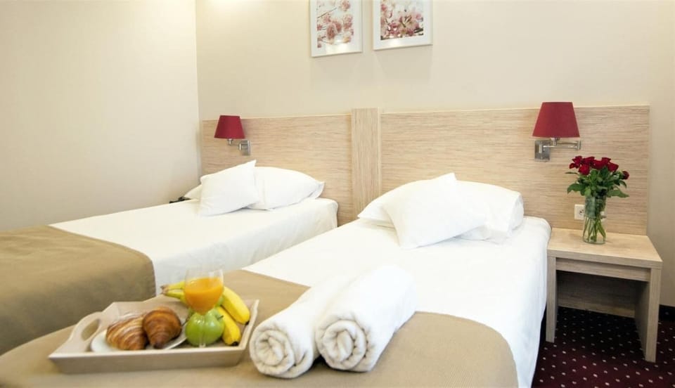 Business Double or Twin Room | Blackout drapes, iron/ironing board, travel crib, free WiFi