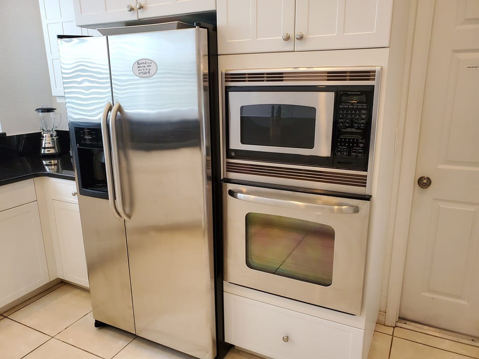 Kitchen refrigerator, microwave and oven
