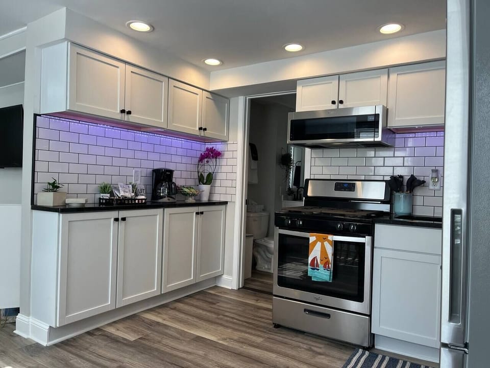 Under-cabinet lights add to kitchen functionality and elegance.