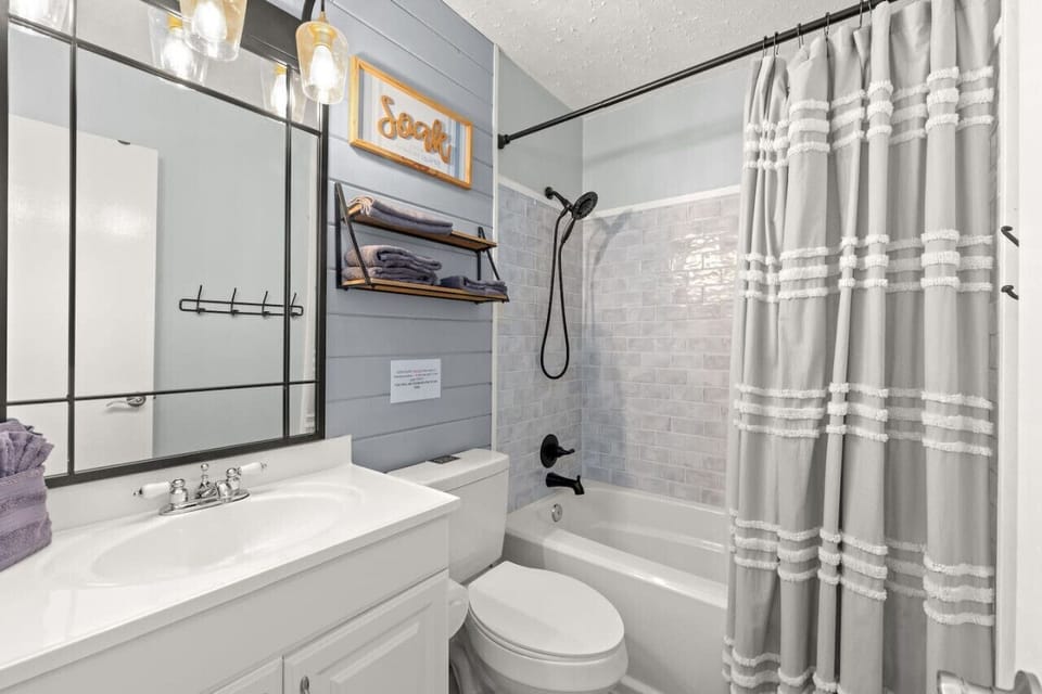 A beautifully updated full bathroom with a shower/tub combo, offering both style and convenience!