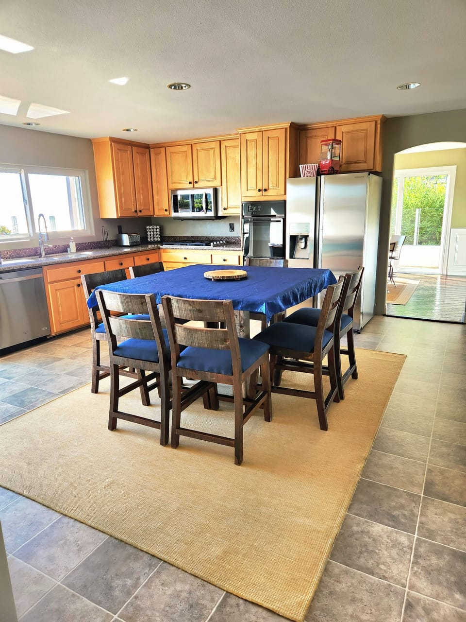 In kitchen, dining table with slider door to pool area. 