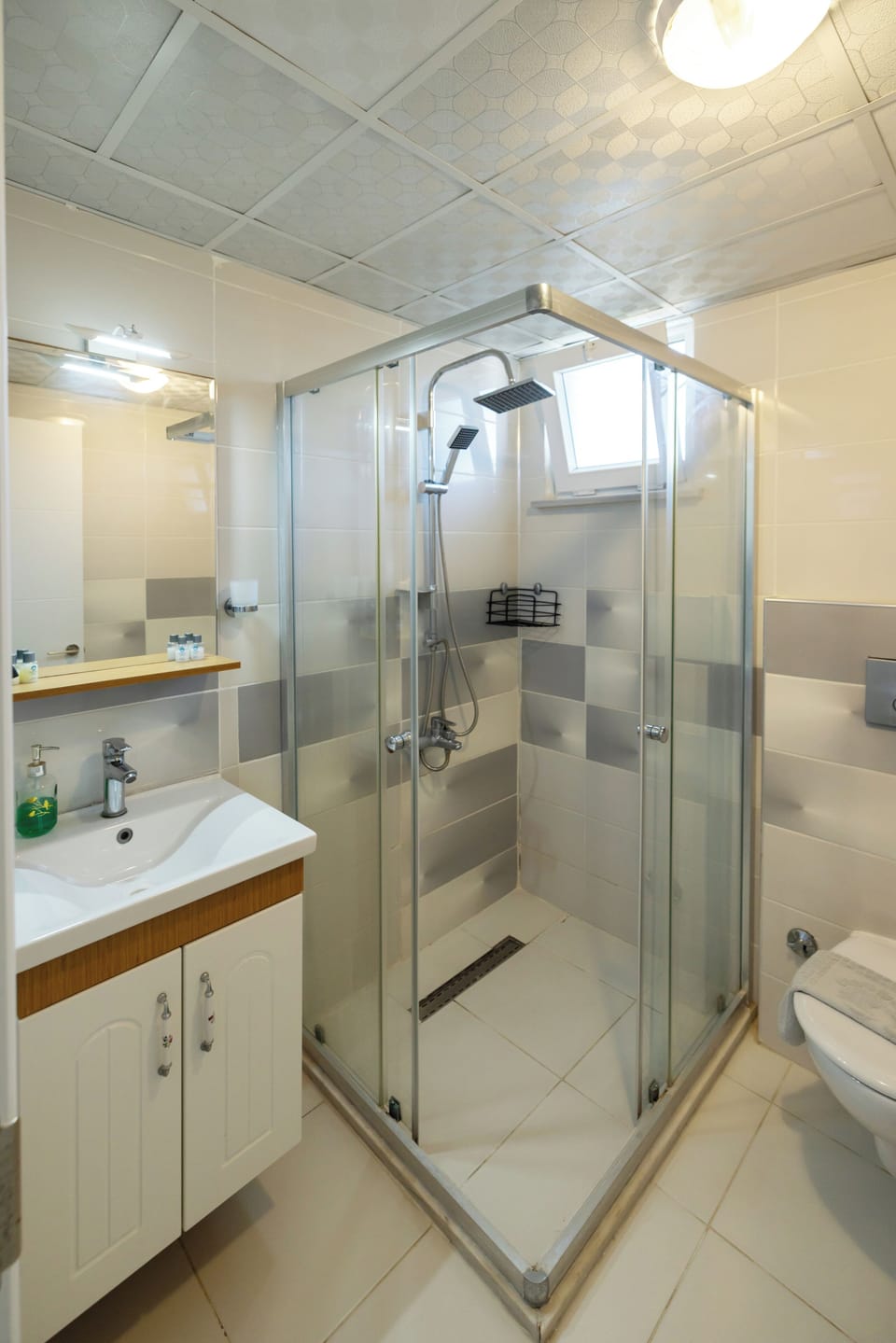 Shower, free toiletries, hair dryer, slippers