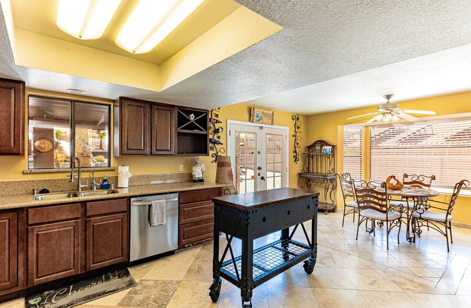 well-lit kitchen and dining area with modern appliances
