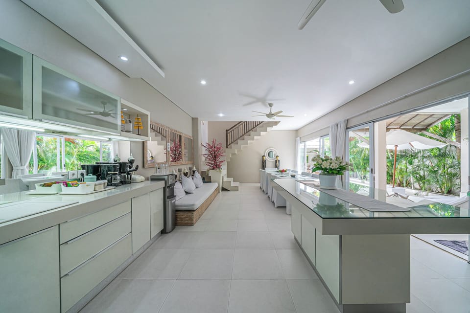 Villa | Private kitchen | Fridge, electric kettle, dining table