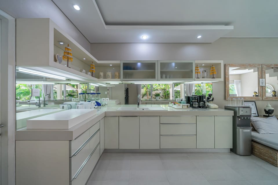 Villa | Private kitchen | Fridge, electric kettle, dining table
