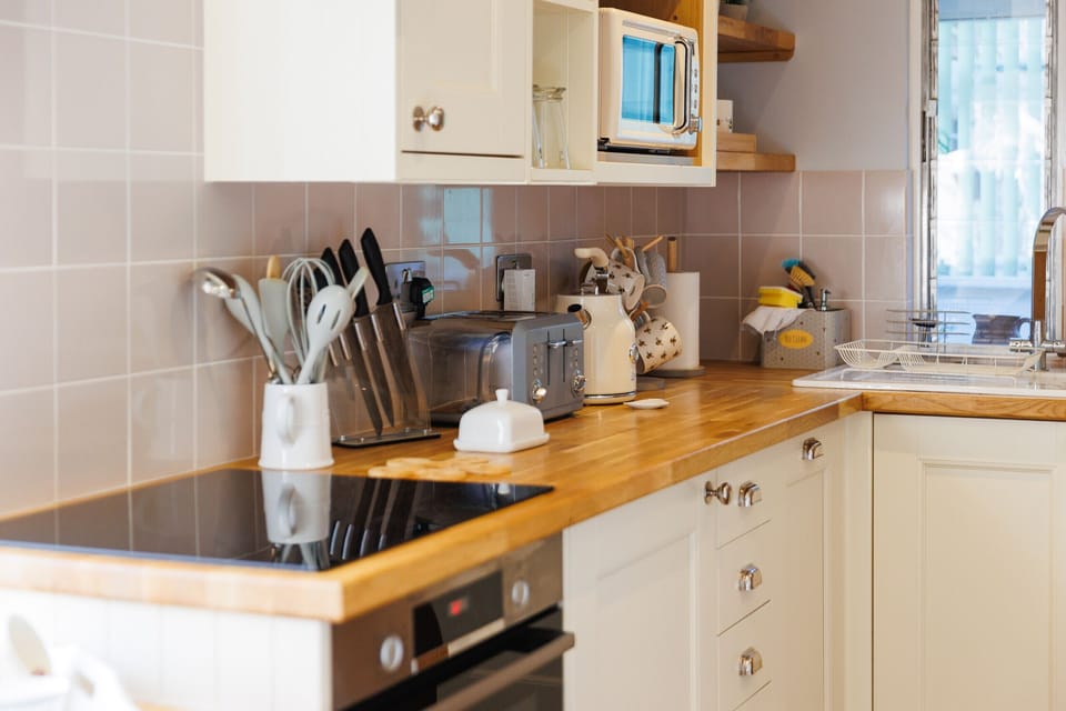 Enjoy the rustic farmhouse kitchen at Old Abbey Farmhouse, complete with a local welcome basket of treats for your stay.