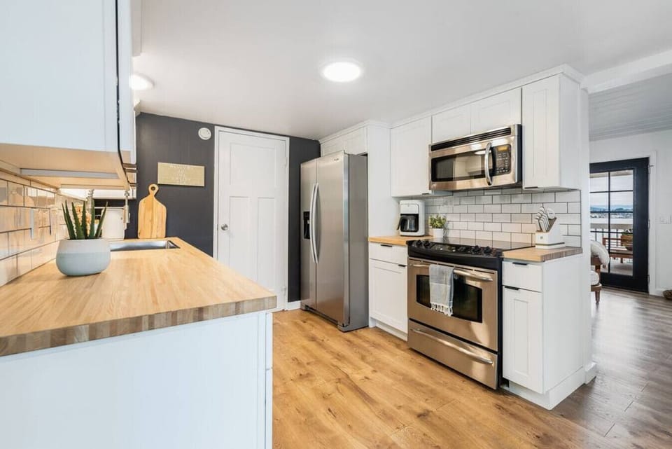 Kitchen features beautiful butcherblock countertops.