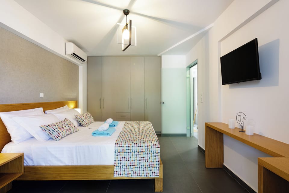 Apartment, 1 Bedroom, Pool View | Pillowtop beds, in-room safe, desk, laptop workspace