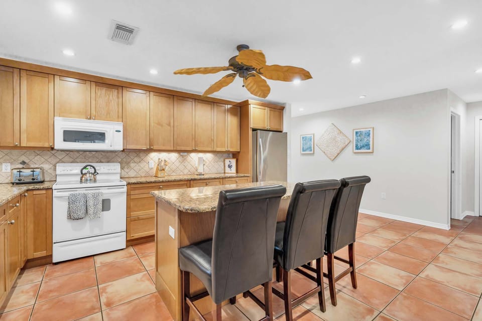 3 additional seats are at the kitchen island for casual dining 