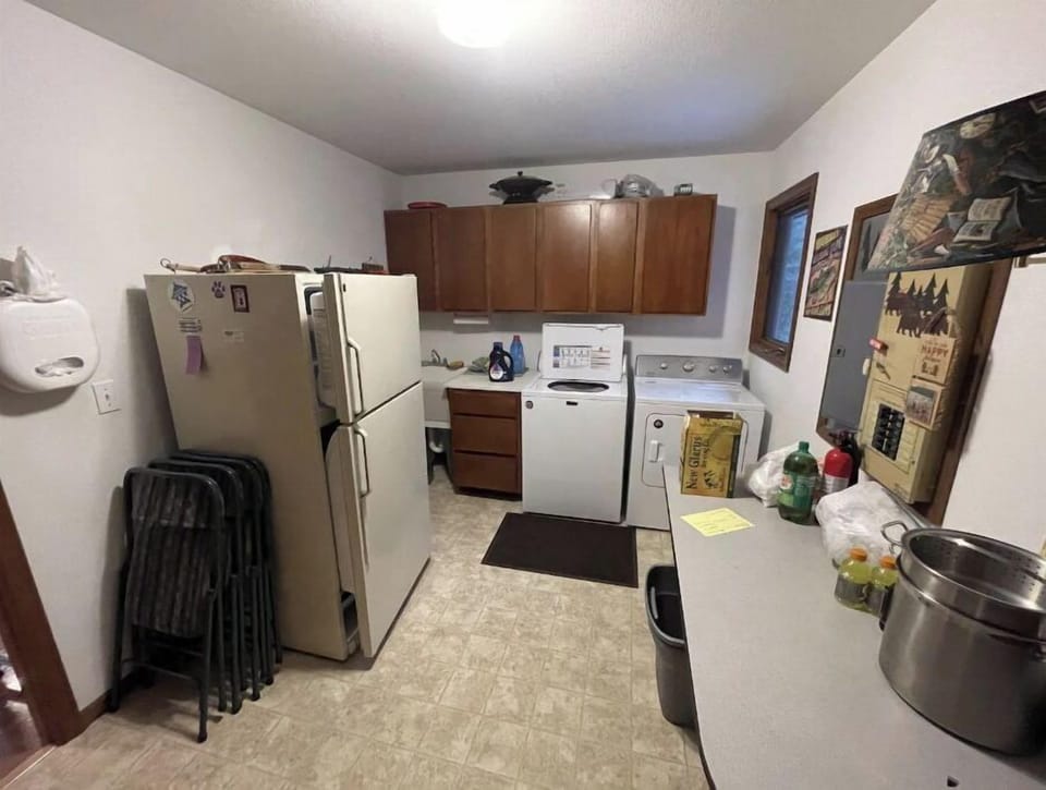 Mudroom with second fridge, new washer and dryer, sink for cleaning fish