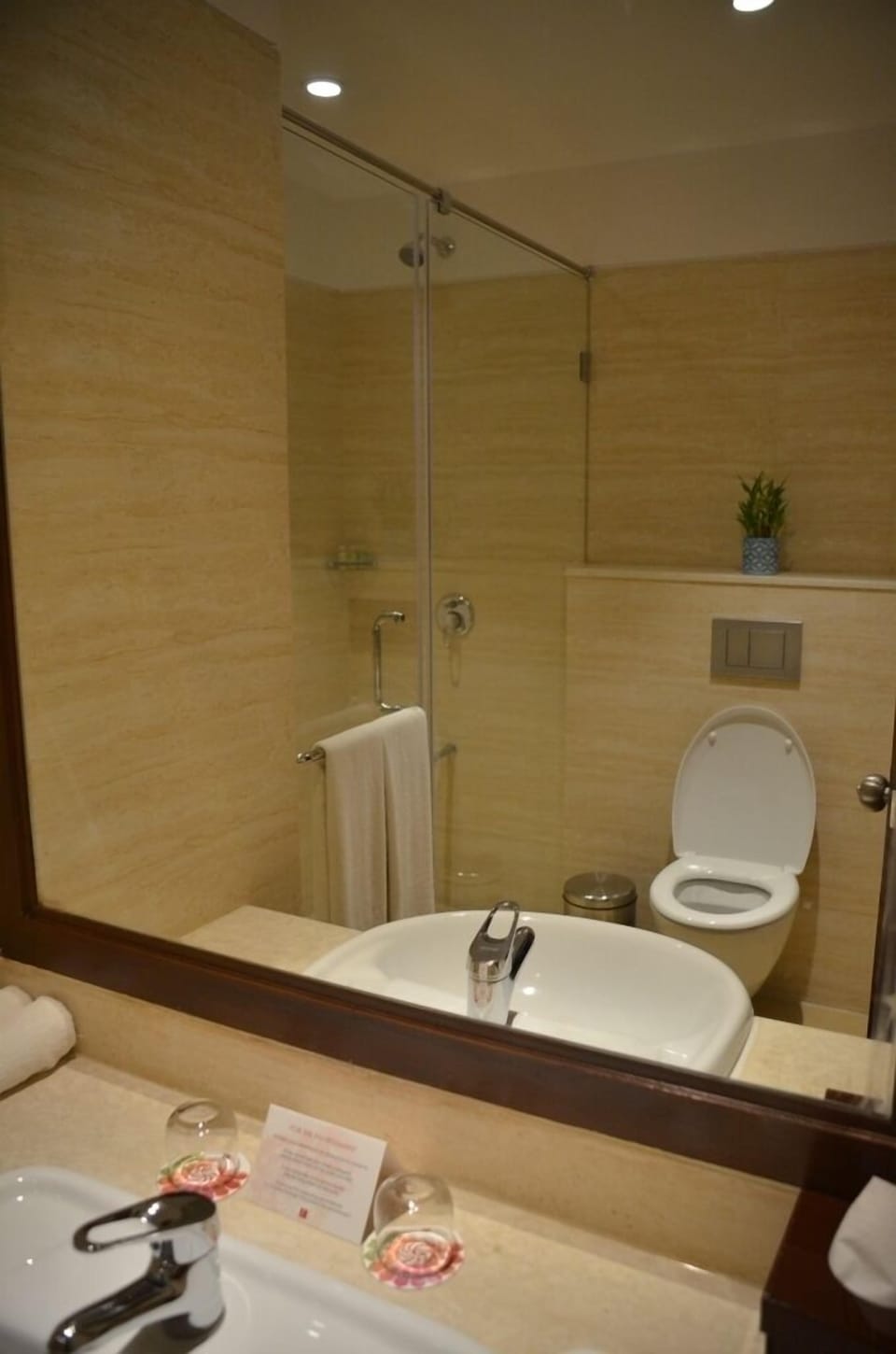 Shower, hair dryer, slippers, towels