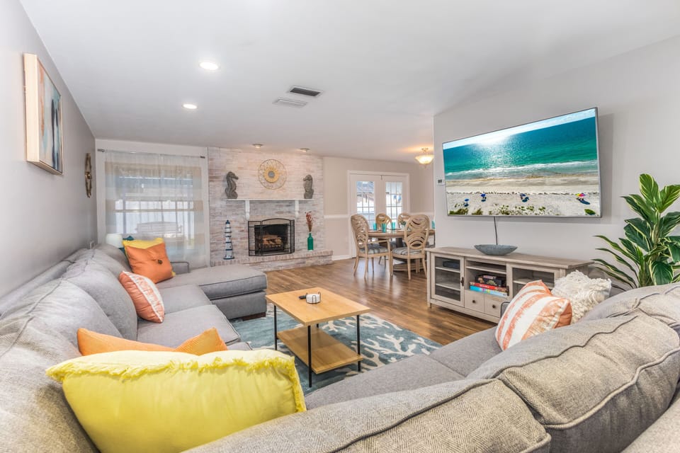 Gorgeous living room with a huge sofa (including a pull-out bed!), big Roku TV