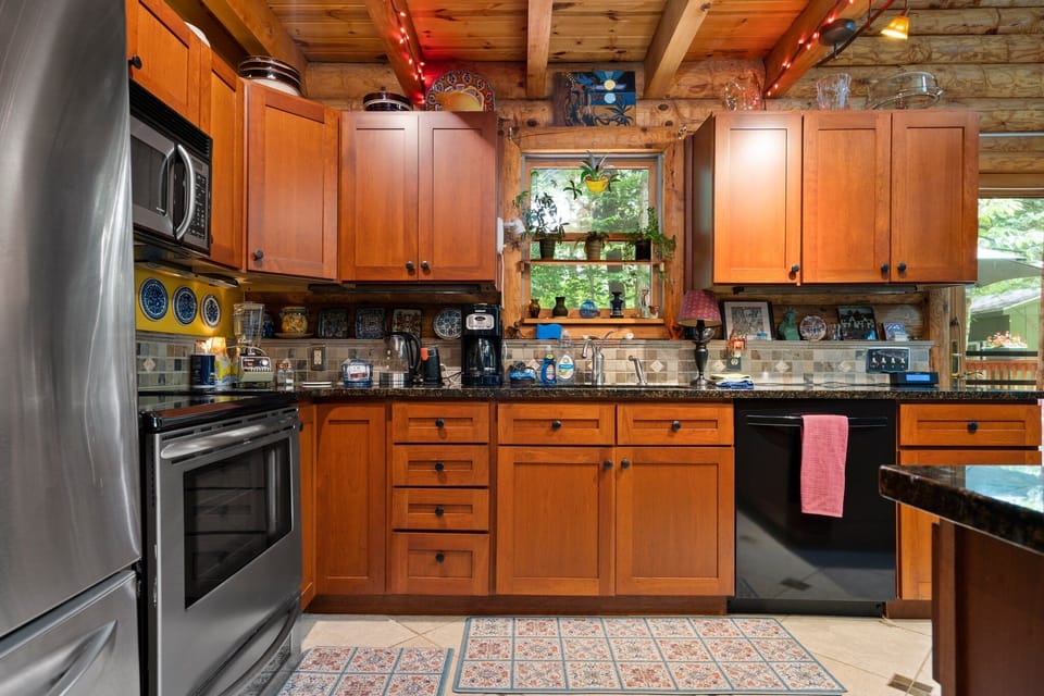 Step into our wooden-themed kitchen, where natural warmth and style combine to create a charming and inviting culinary space.