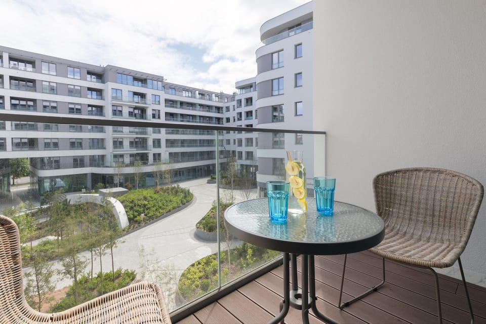 The balcony provides a perfect spot for enjoying the fresh air. 