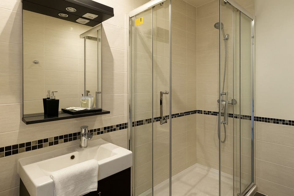 Superior Double Room, Kitchenette | Bathroom | Shower, free toiletries, hair dryer, towels